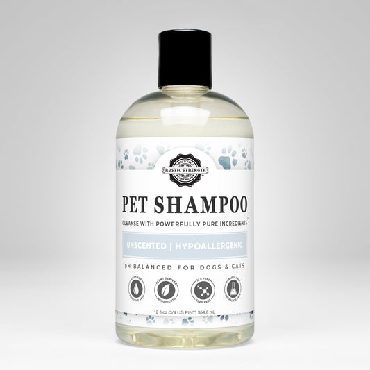 A clear bottle of Rustic Strength Pet Shampoo | Soothing & Deodorizing | Unscented with a black cap features blue paw prints, plant-based and hypoallergenic text, and icons for non-toxic, dog- and cat-safe use.