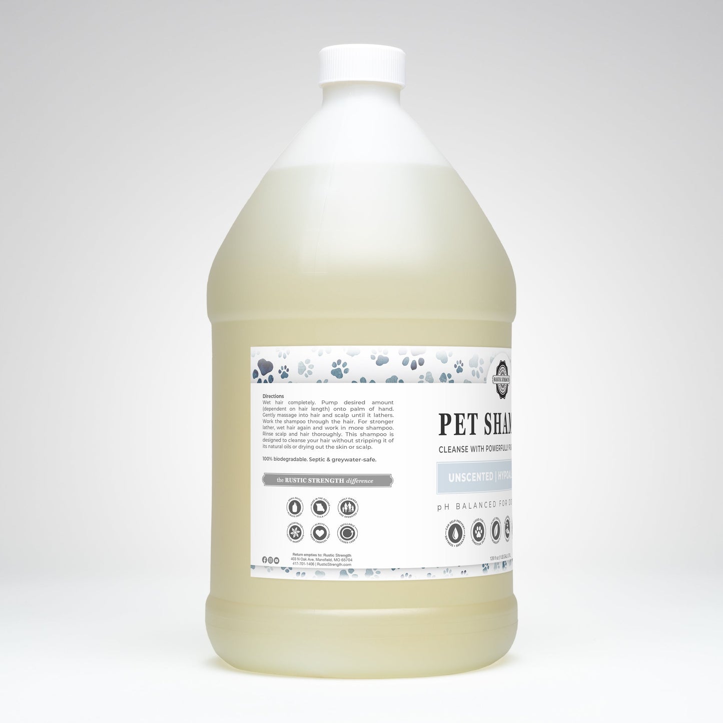 The gallon jug of Rustic Strength Pet Shampoo | Soothing & Deodorizing | Unscented features a white cap and label, plant-based formula, and icons for pH balanced, biodegradable, non-toxic on the label.