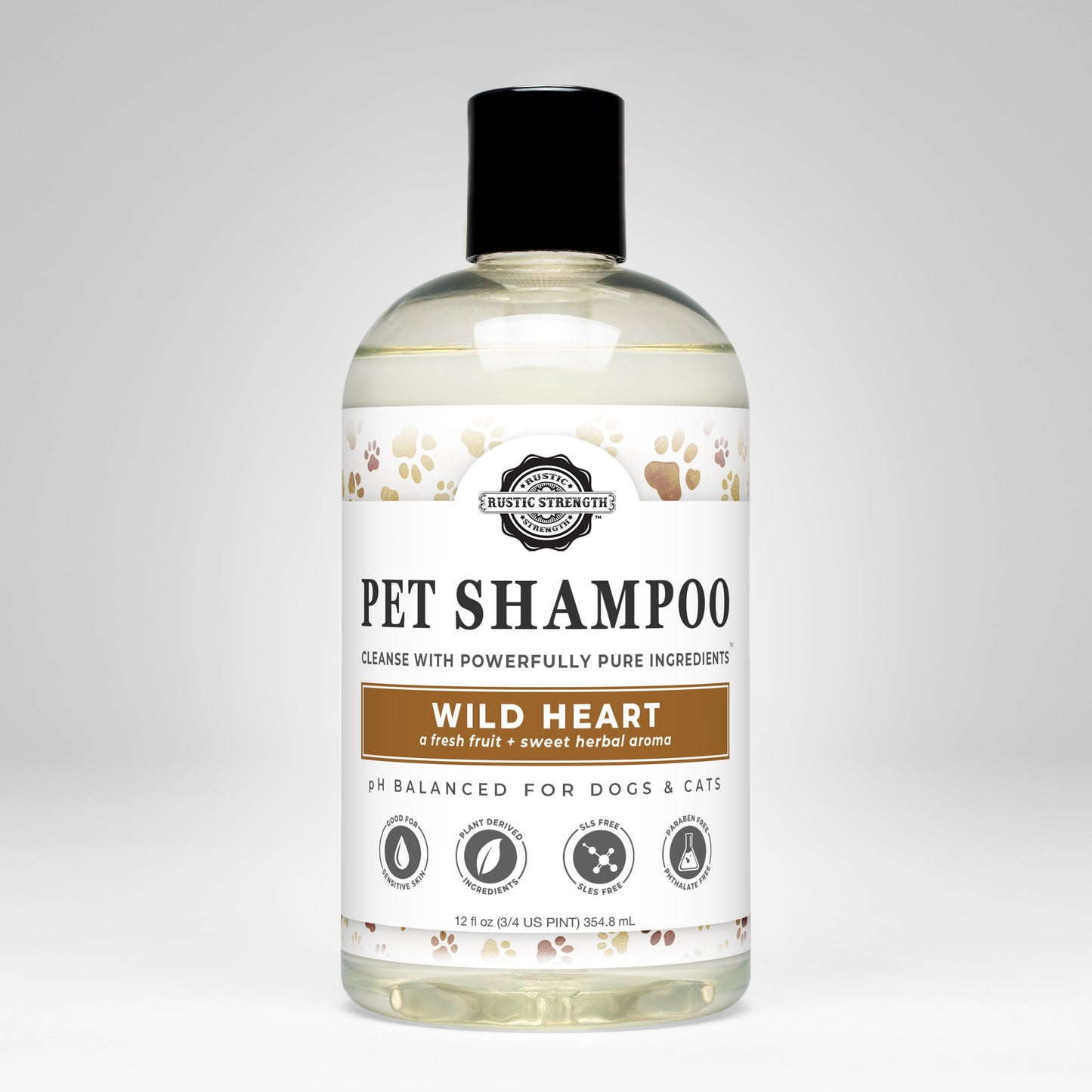 A clear bottle of Rustic Strength Pet Shampoo | Soothing & Deodorizing | Wild Heart, with a black cap, features paw prints and icons. The pH-balanced formula for dogs and cats is made from non-toxic, plant-based ingredients.
