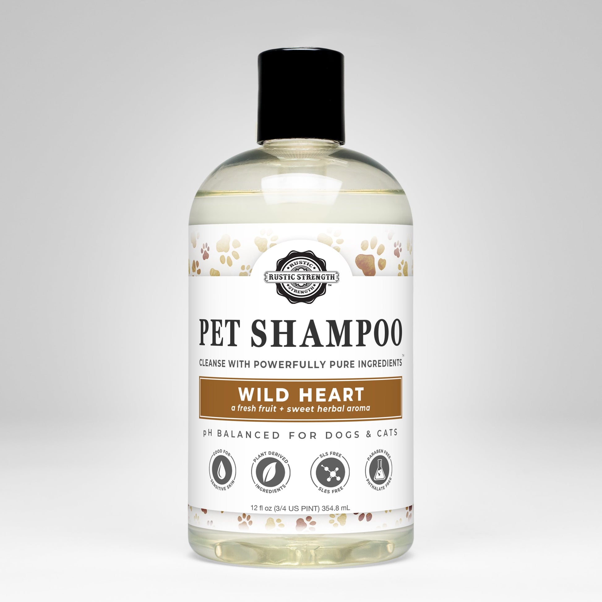 A clear bottle of Rustic Strength Pet Shampoo | Soothing & Deodorizing | Wild Heart, with a black cap, features paw prints and icons. The pH-balanced formula for dogs and cats is made from non-toxic, plant-based ingredients.