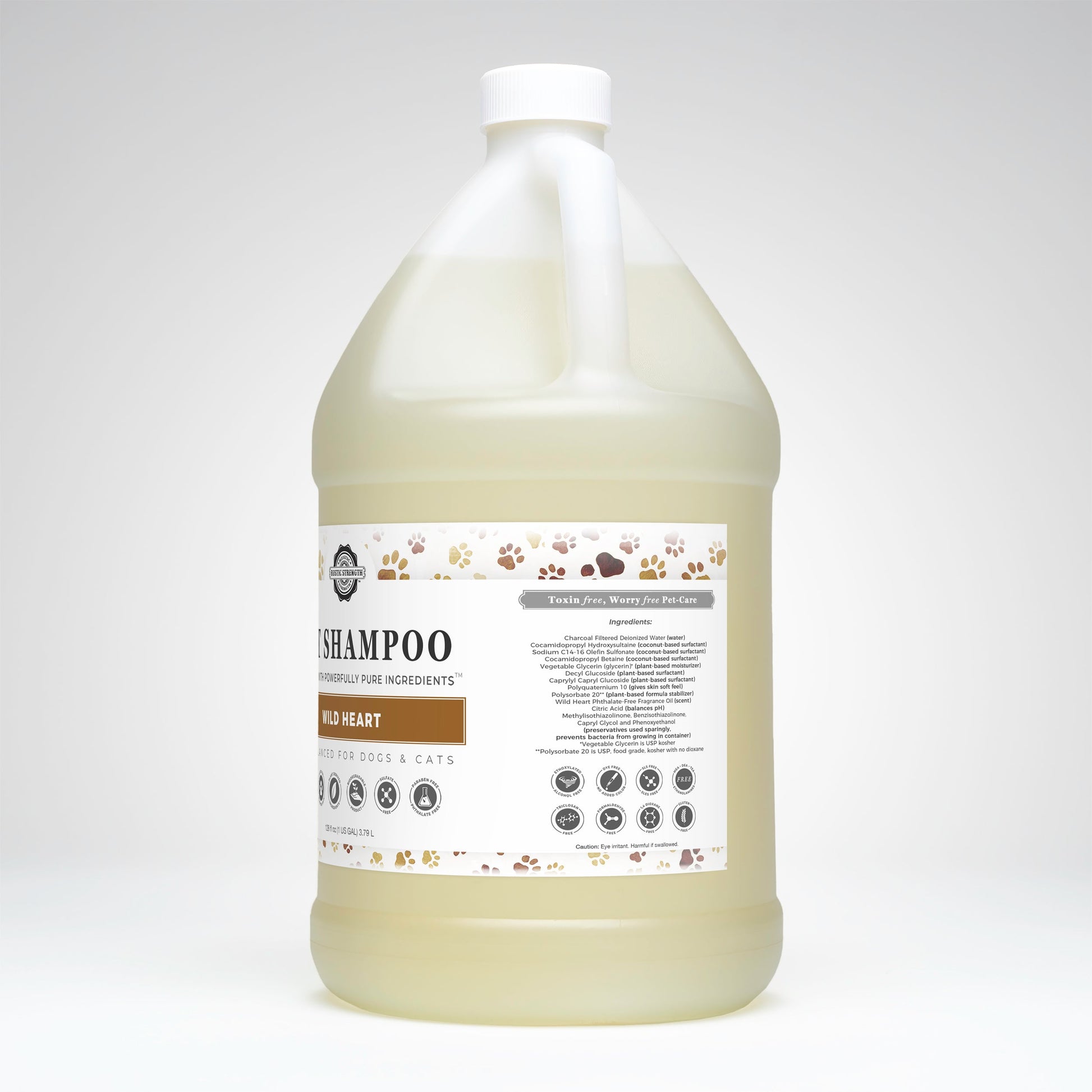 A large gallon of Rustic Strengths Wild Heart Pet Shampoo | Soothing & Deodorizing, for dogs and cats, has a white label with brown/beige paw prints, pet illustrations, and ingredient list. Non-toxic formula for gentle, effective cleaning.