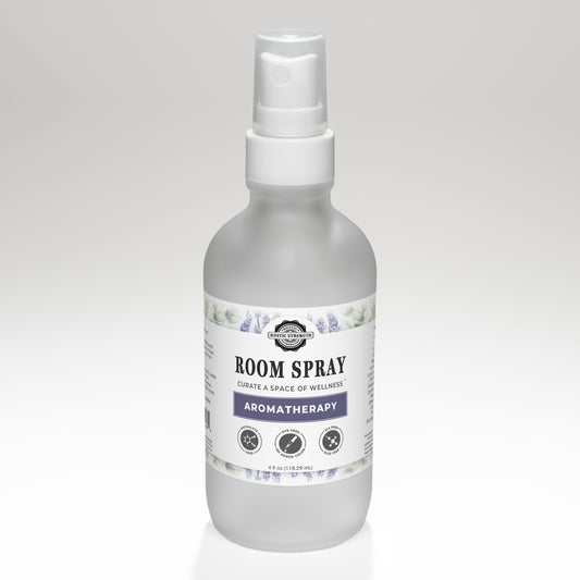 Rustic Strength aromatherapy room spray with a sleek glass bottle and spray nozzle, designed to freshen and scent indoor spaces.