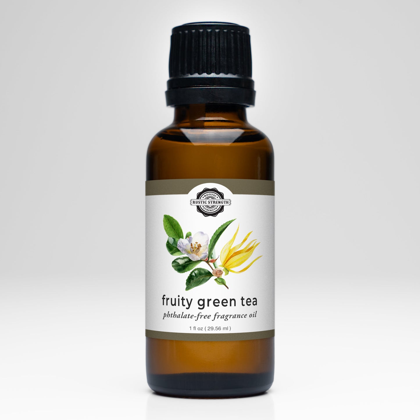 A brown glass bottle with a black cap labeled Fruity Green Tea Phthalate-Free Fragrance Oil by Rustic Strength, featuring an illustration of tea leaves, white flowers, and yellow blossoms on the front.