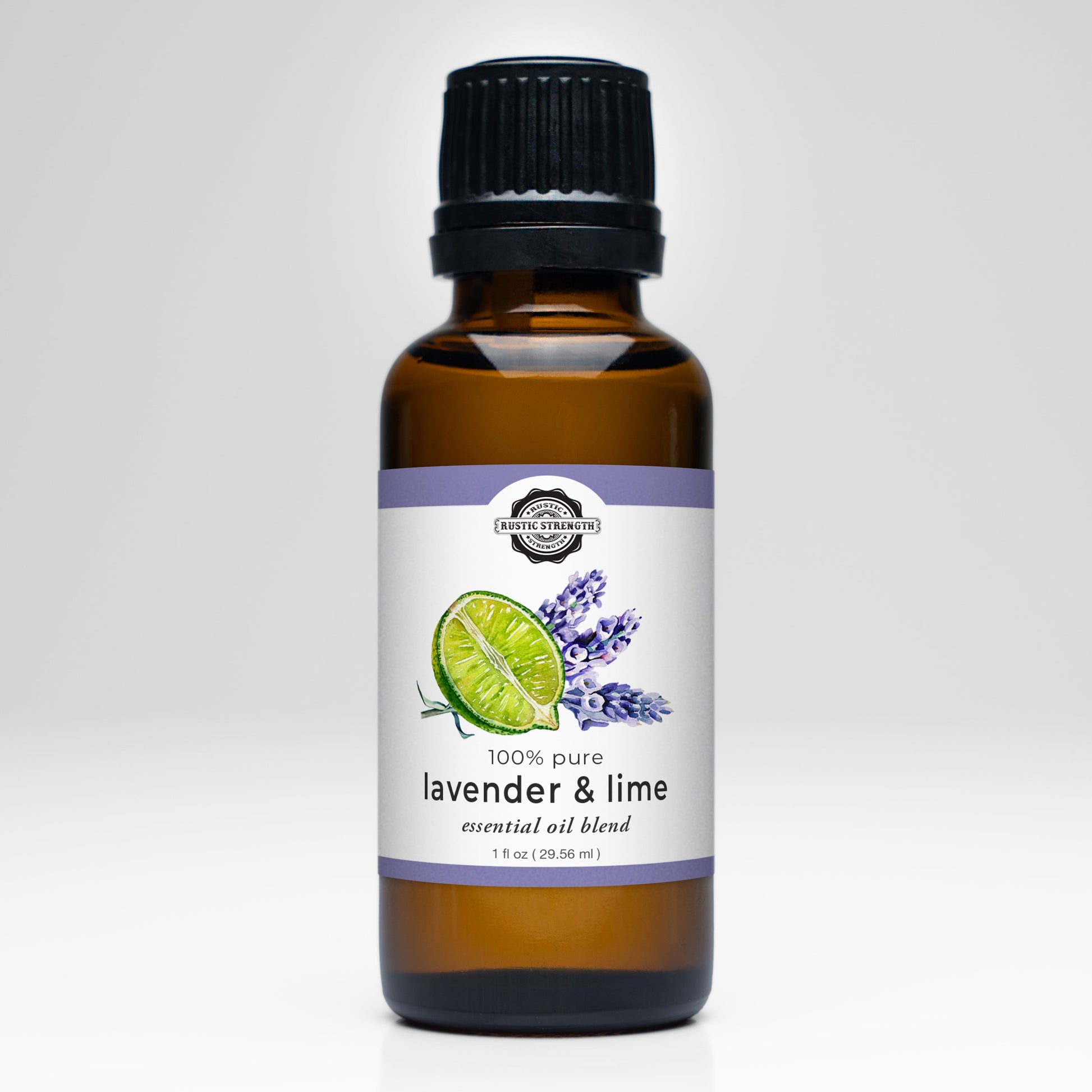 A brown glass bottle with a black cap labeled Rustic Strength Lavender & Lime Essential Oil Blend, featuring lime and lavender images—ideal for aromatherapy—displayed on a white background.