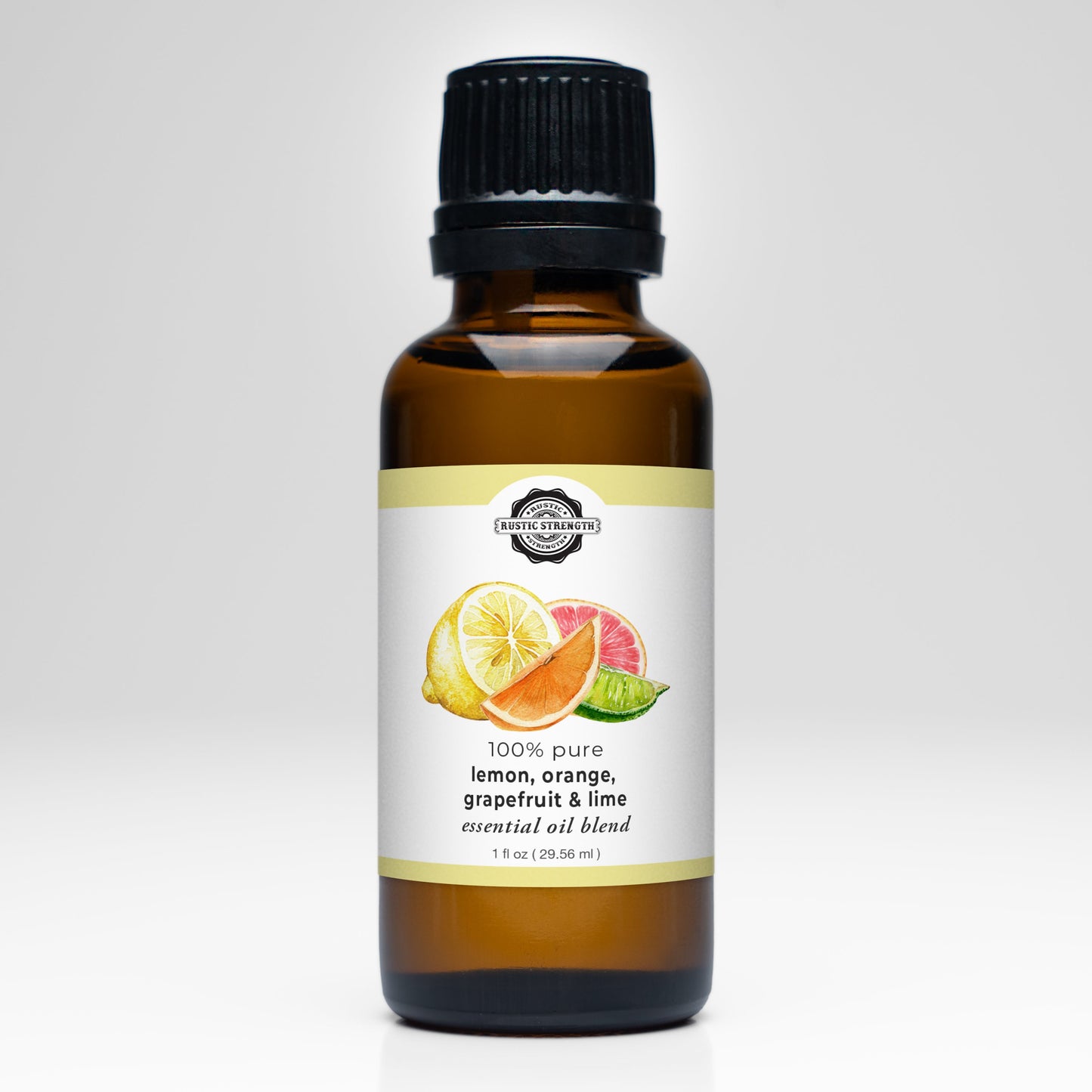 Rustic Strength Lemon, Orange, Grapefruit & Lime Essential Oil Blend comes in a brown glass bottle with a black cap. The label displays citrus slices and notes its 100% pure—ideal for aromatherapy with a refreshing citrus scent.