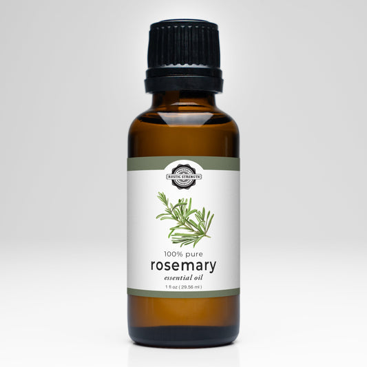 Rustic Strength Rosemary Essential Oil comes in a brown glass bottle with a black cap, labeled 100% pure for aromatherapy, featuring a rosemary illustration on a white background, and contains 1 fl oz (29.56 ml).