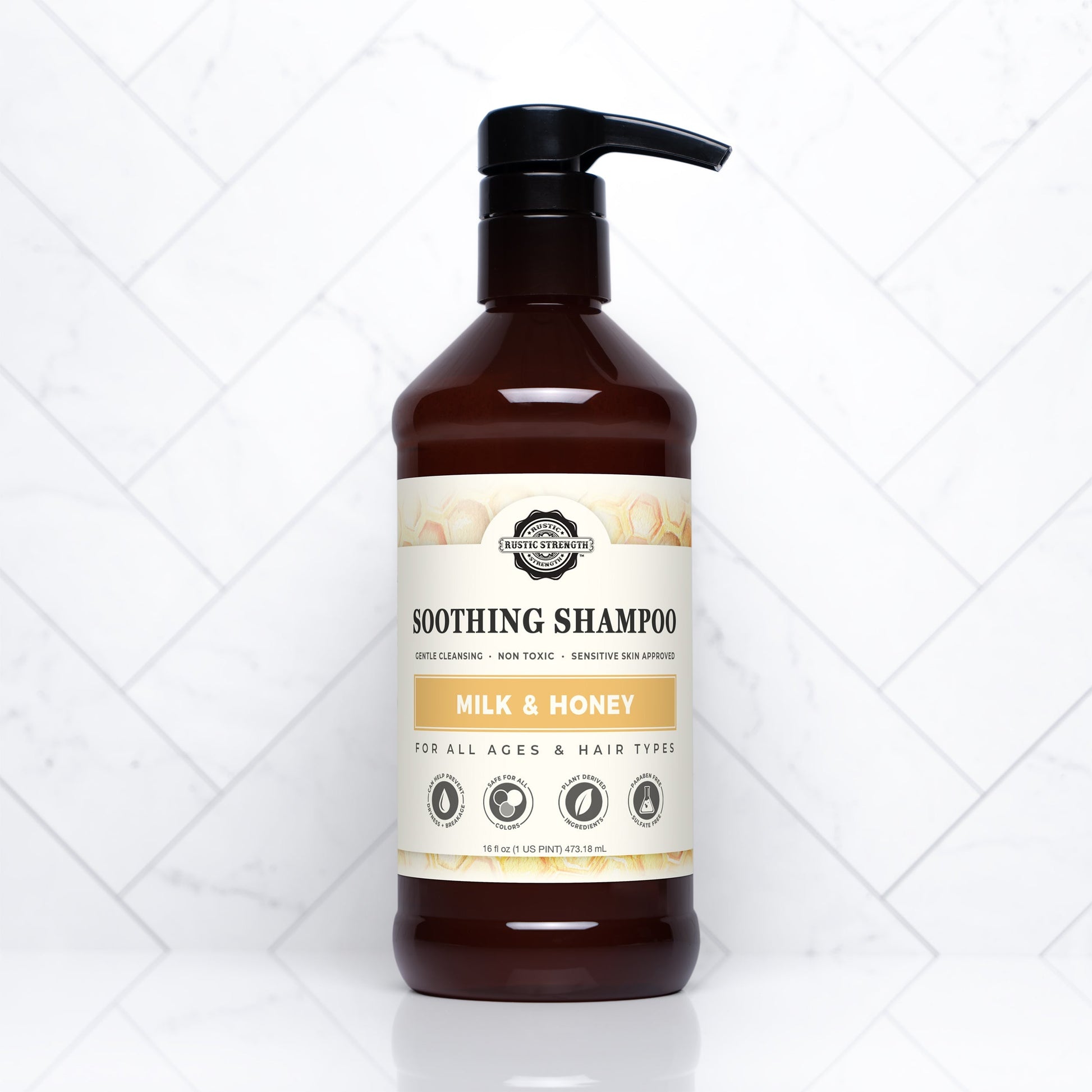 Rustic Strength Soothing Shampoo with Milk & Honey, 16 oz bottle, showing the shampoo's creamy texture and natural ingredients