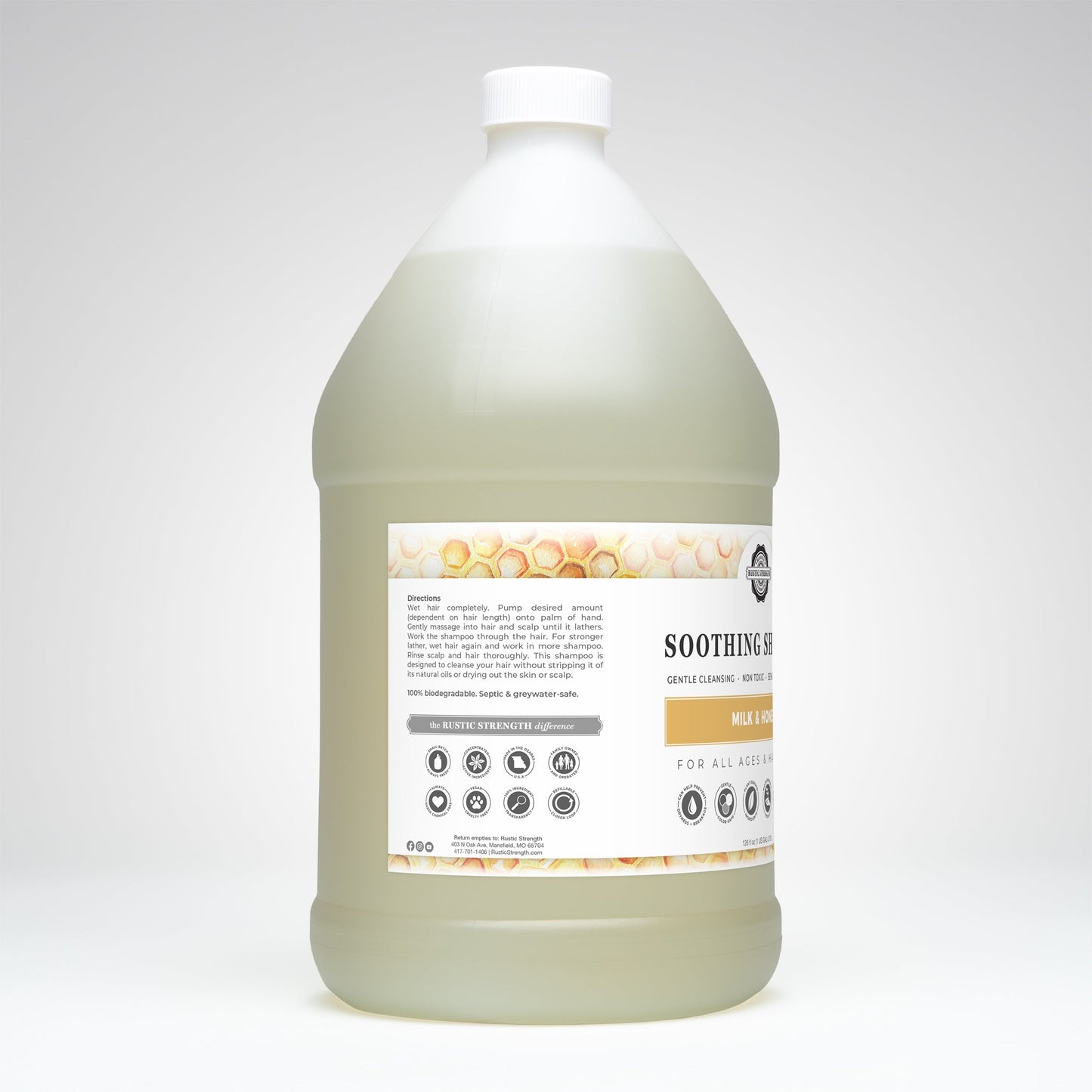 Rustic Strength soothing shampoo with milk and honey in a 16 oz bottle, showing the shampoo's creamy texture and natural ingredients.