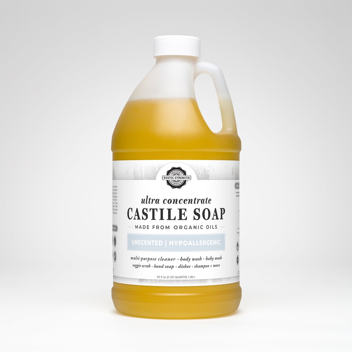 Rustic Strength Castile Soap - Ultra Concentrate | Unscented is a large, clear jug with a handle, containing yellow liquid. This hypoallergenic multi-purpose cleaner is made from organic oils for gentle yet effective cleaning.