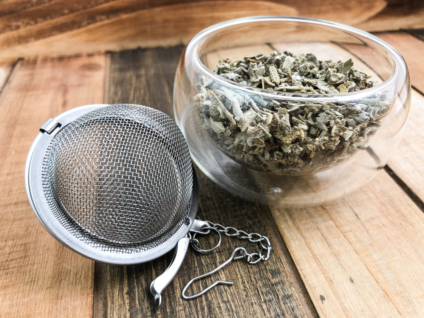 Dried sage herb from HerbalRoseApothecary, showing fresh green leaves and woody stems, ideal for culinary or herbal uses.