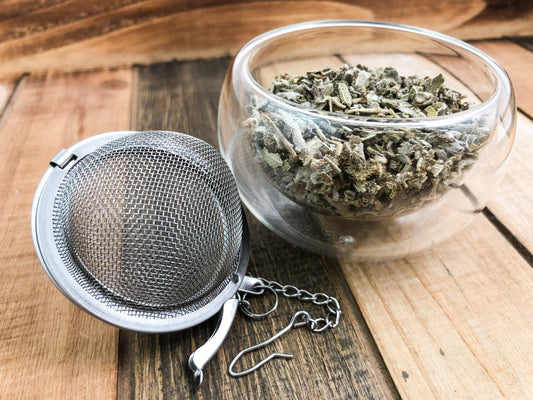Dried sage herb from HerbalRoseApothecary, showing fresh green leaves and woody stems, ideal for culinary or herbal uses.