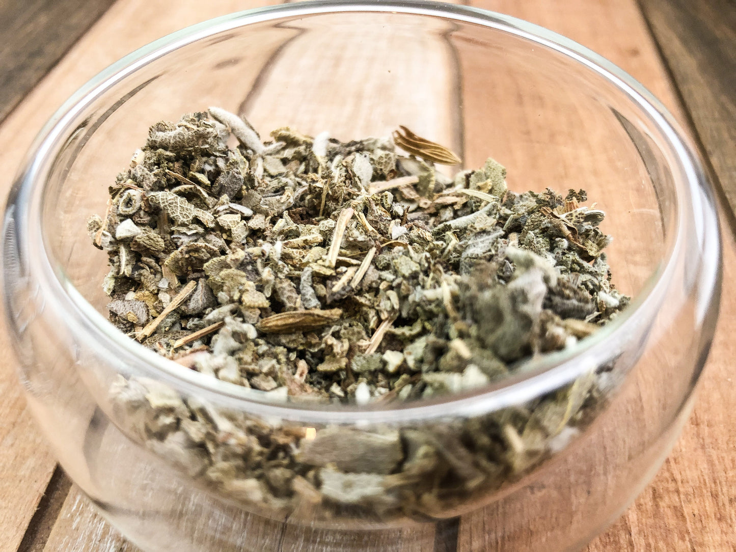 Dried sage herb from HerbalRoseApothecary, showing fresh green leaves and woody stems for culinary and herbal use.