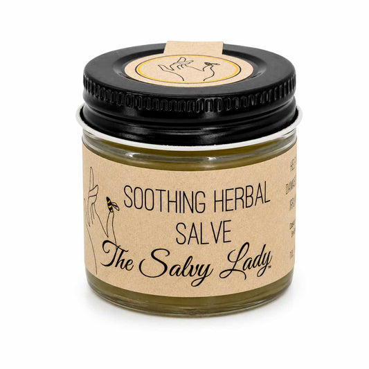 Creamy herbal salve in a small jar, soothing for skin relief, from The Salvy Lady’s bath and body collection.
