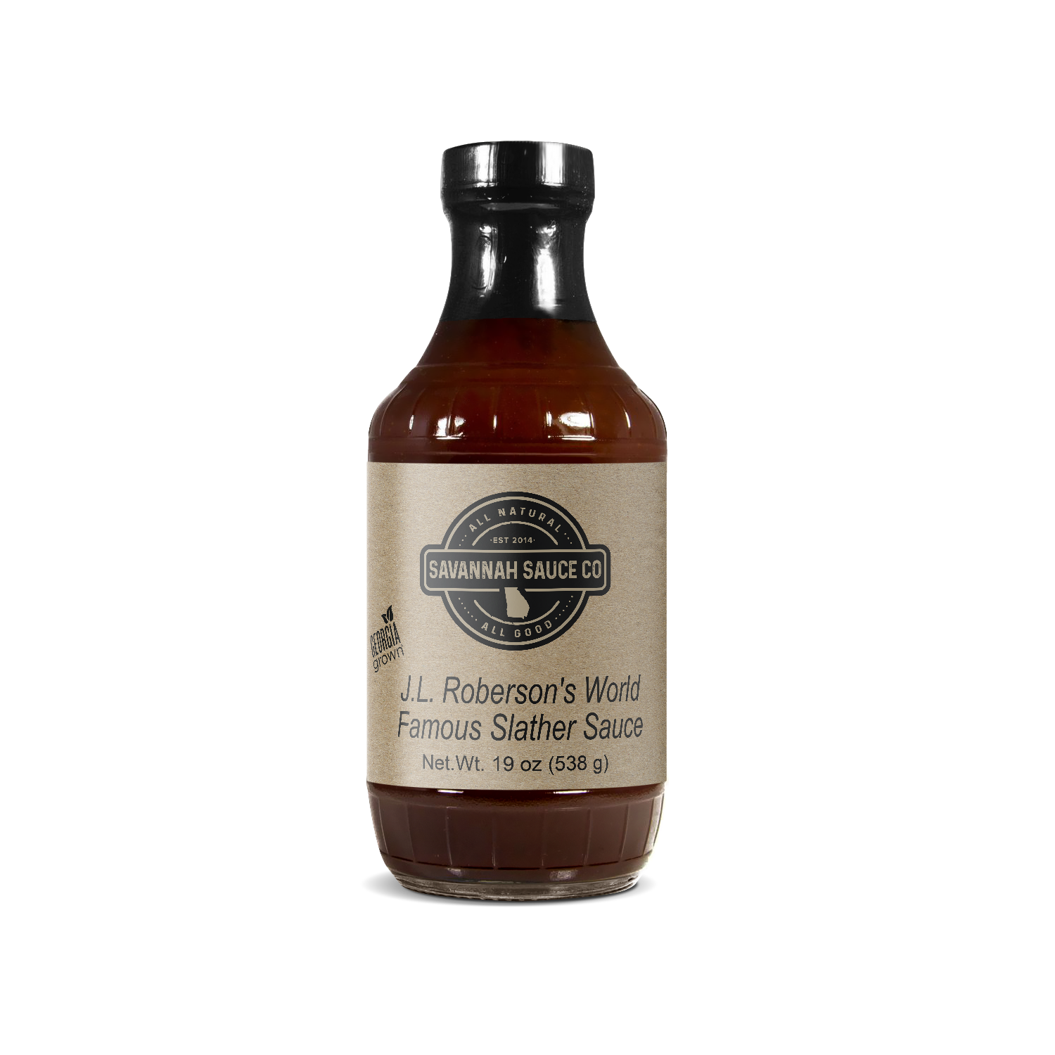 A 19 oz (538g) glass bottle of SavannahSauceCompany J.L. Roberson’s World Famous Slather Sauce features natural hickory-smoked dark brown sauce, a beige label, and a black cap.