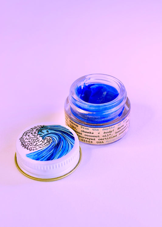 Plant Makeup SEA Lip Balm, a natural body makeup product with a soothing sea-inspired formula and sleek packaging.