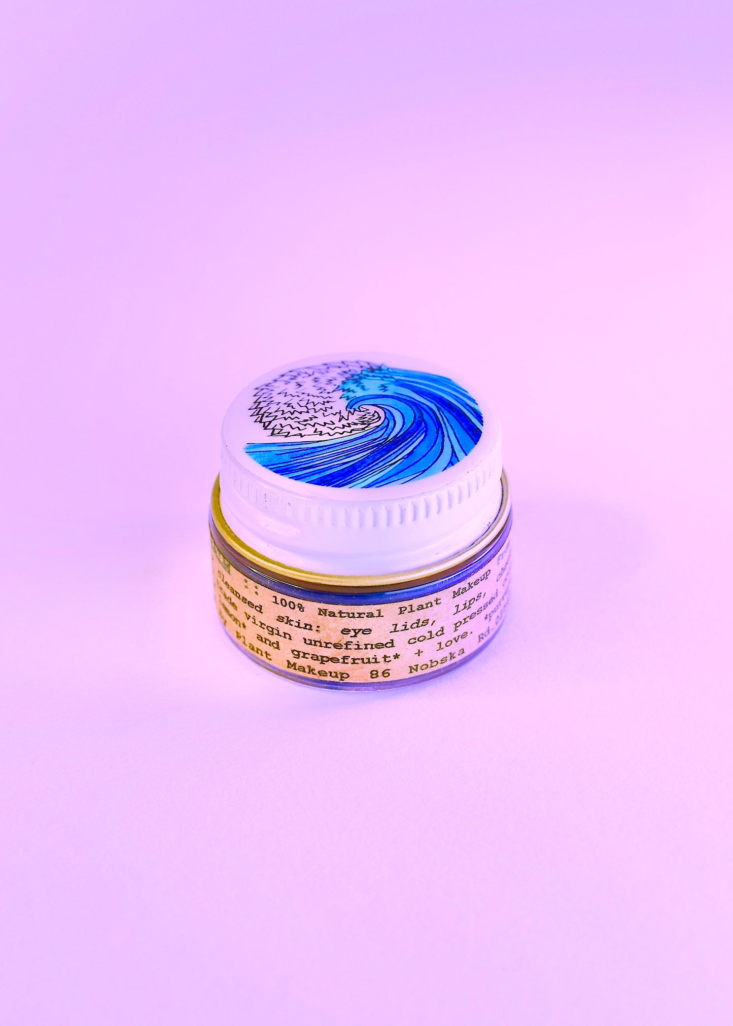 Plant Makeup SEA Lip Balm in sleek packaging, shown as a natural body makeup product designed for nourishing and enhancing lips.