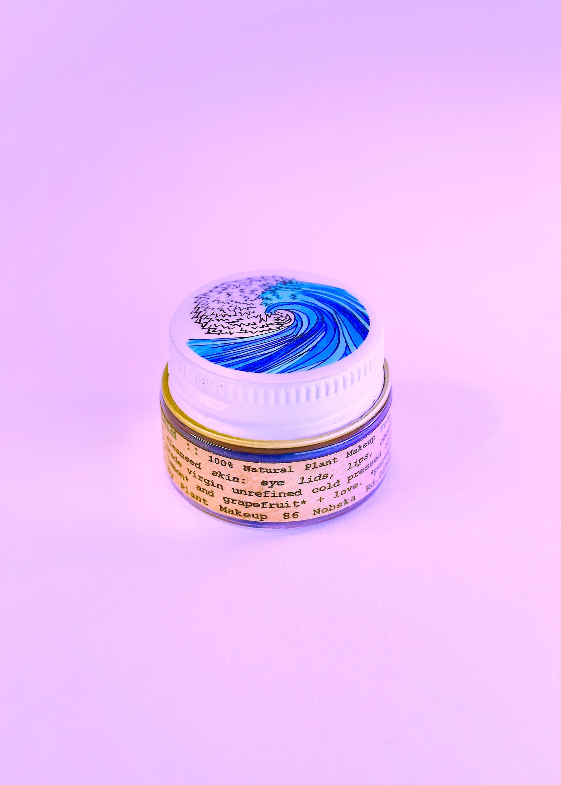Plant Makeup SEA Lip Balm in sleek packaging, shown as a natural body makeup product designed for nourishing and enhancing lips.