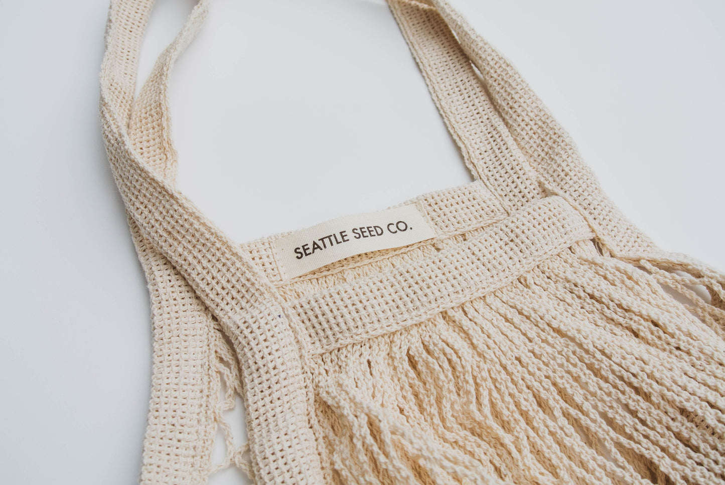 French Market Tote by Seattle Seed Company, cotton string bag with handles, perfect for shopping and casual outings.