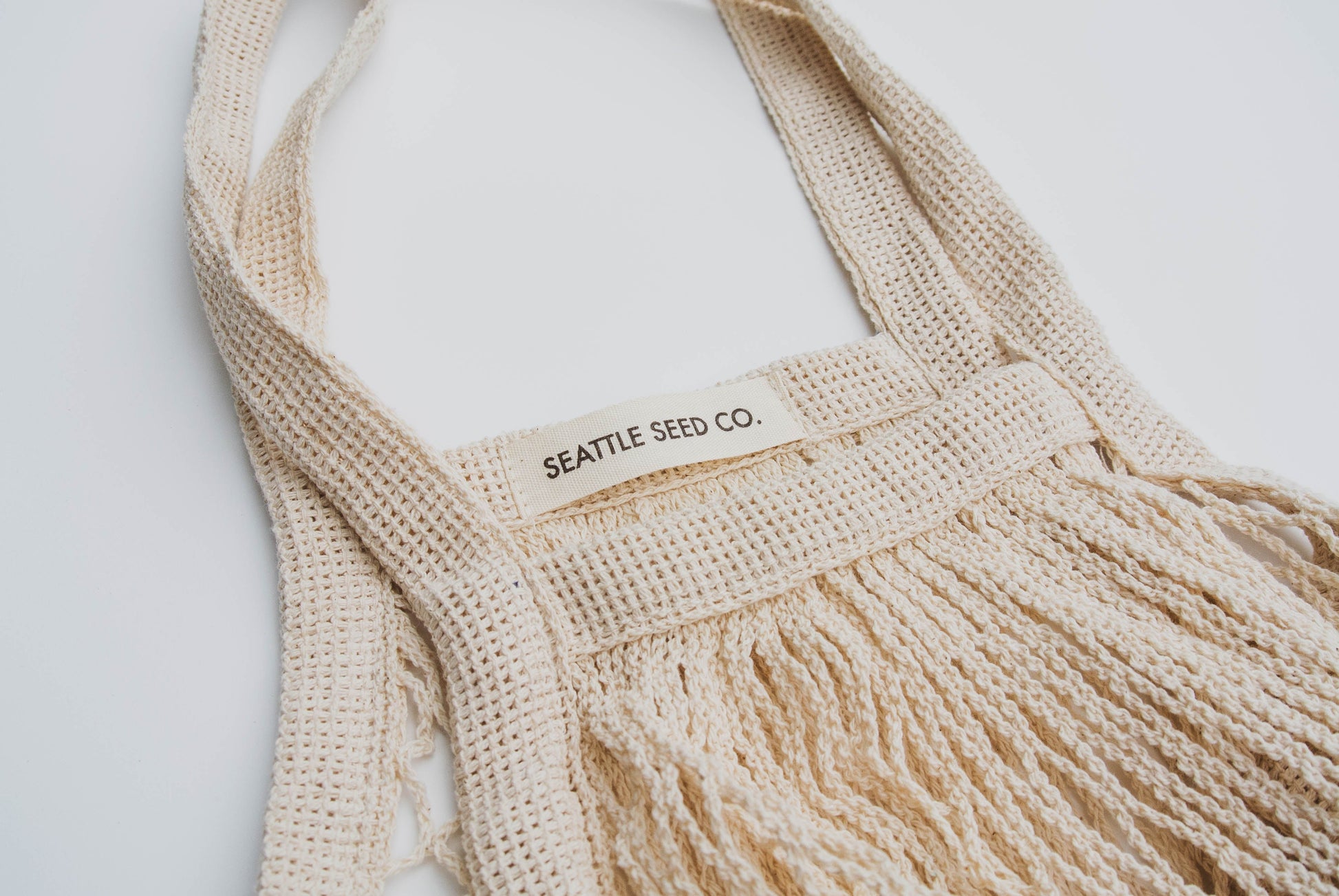 French Market Tote by Seattle Seed Company, cotton string bag with handles, perfect for shopping and casual outings.