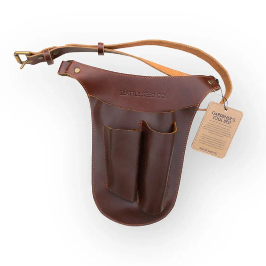 Genuine leather gardener's tool belt from Harvest Essentials by Seattle Seed Company, with multiple pouches and adjustable straps.
