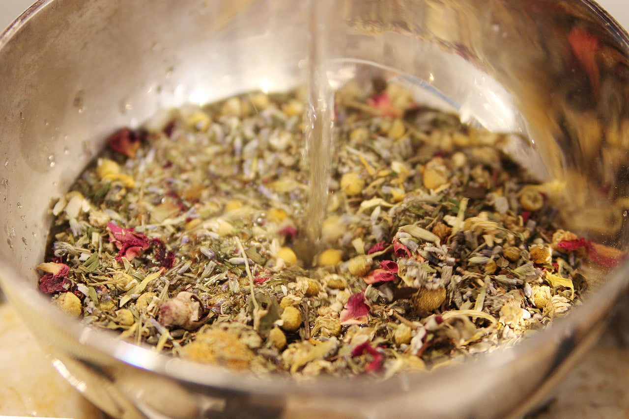 Herbal steam facial blend from Seattle Seed Company with dried herbs and botanicals in a glass jar.