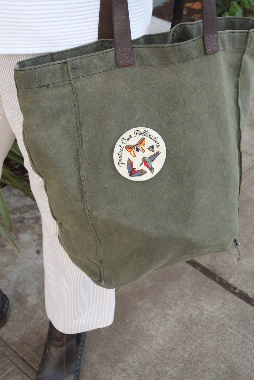 Pollinator Pride patch and sticker kit by Seattle Seed Company, featuring colorful designs to support pollinator awareness.
