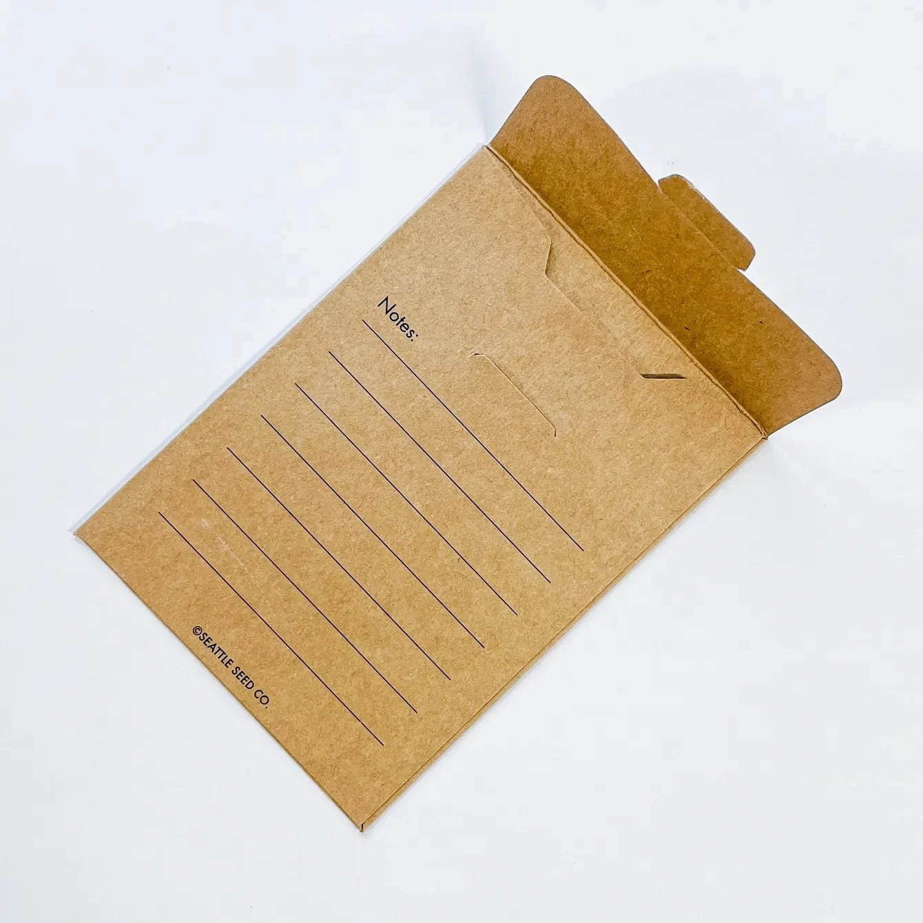 Seed saving envelopes from Seattle Seed Company, featuring durable paper and secure closure for storing and labeling seeds.
