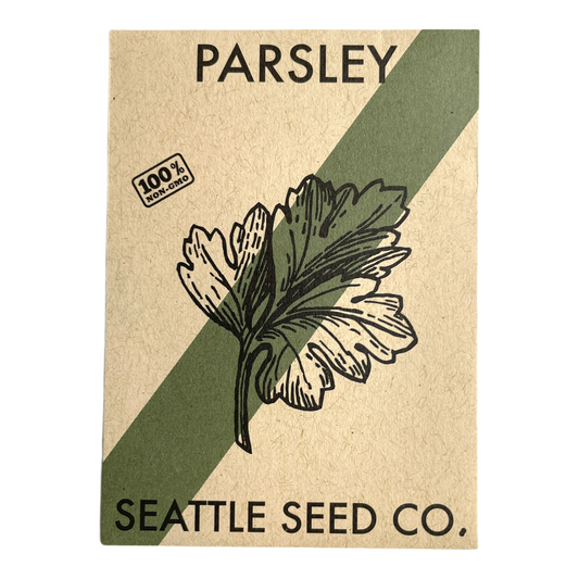 Fresh dark green Italian flat leaf parsley herb from Seattle Seed Company, showing vibrant leaves on a sprig.