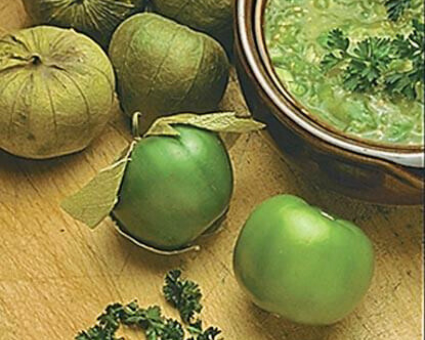 Seeds 'n Such Toma Verde (Green Husk) Tomato Seeds—perfect for growing fresh green tomatillos to make vibrant homemade Mexican Salsa Verde garnished with chopped parsley.