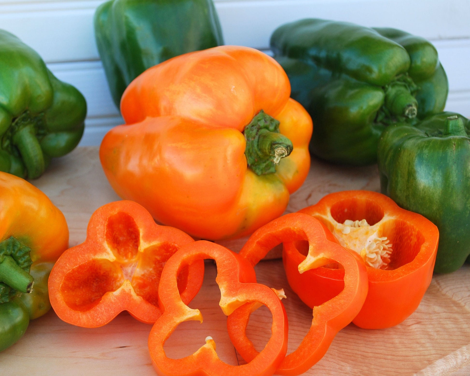 Packet of Seeds 'n Such orange bell sweet bell pepper seeds, showcasing vibrant orange pepper seeds in a labeled packet.