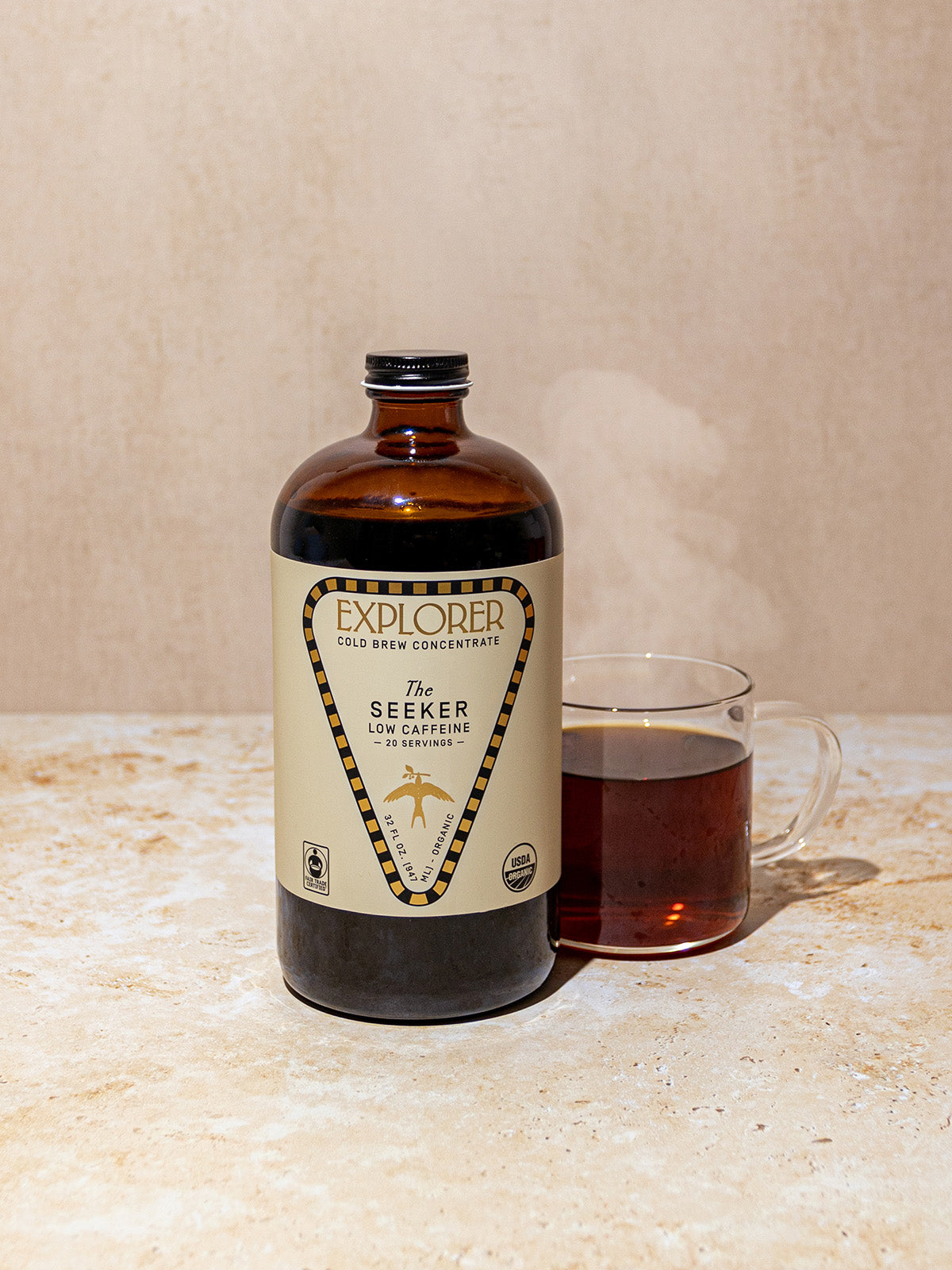32oz Explorer Cold Brew coffee concentrate bottle with seeker branding, showcasing the cold brew packaging and label details.