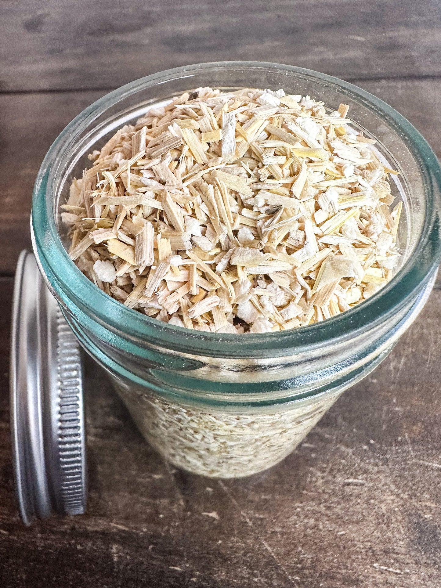 Small jar of dried Siberian ginseng herbs from HerbalRoseApothecary, showcasing the herb jar with dried ginseng inside.