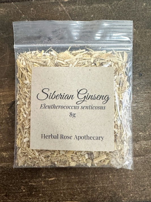 Dried Siberian ginseng herb in an 8g package from HerbalRoseApothecary, showing the natural, leafy herb in a clear container.