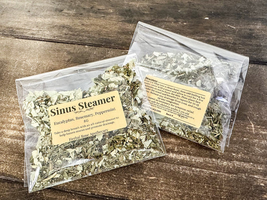 Herbalroseapothecary sinus steamers in a clear bowl with herbal blends and steam rising, used for sinus relief and nasal congestion relief.