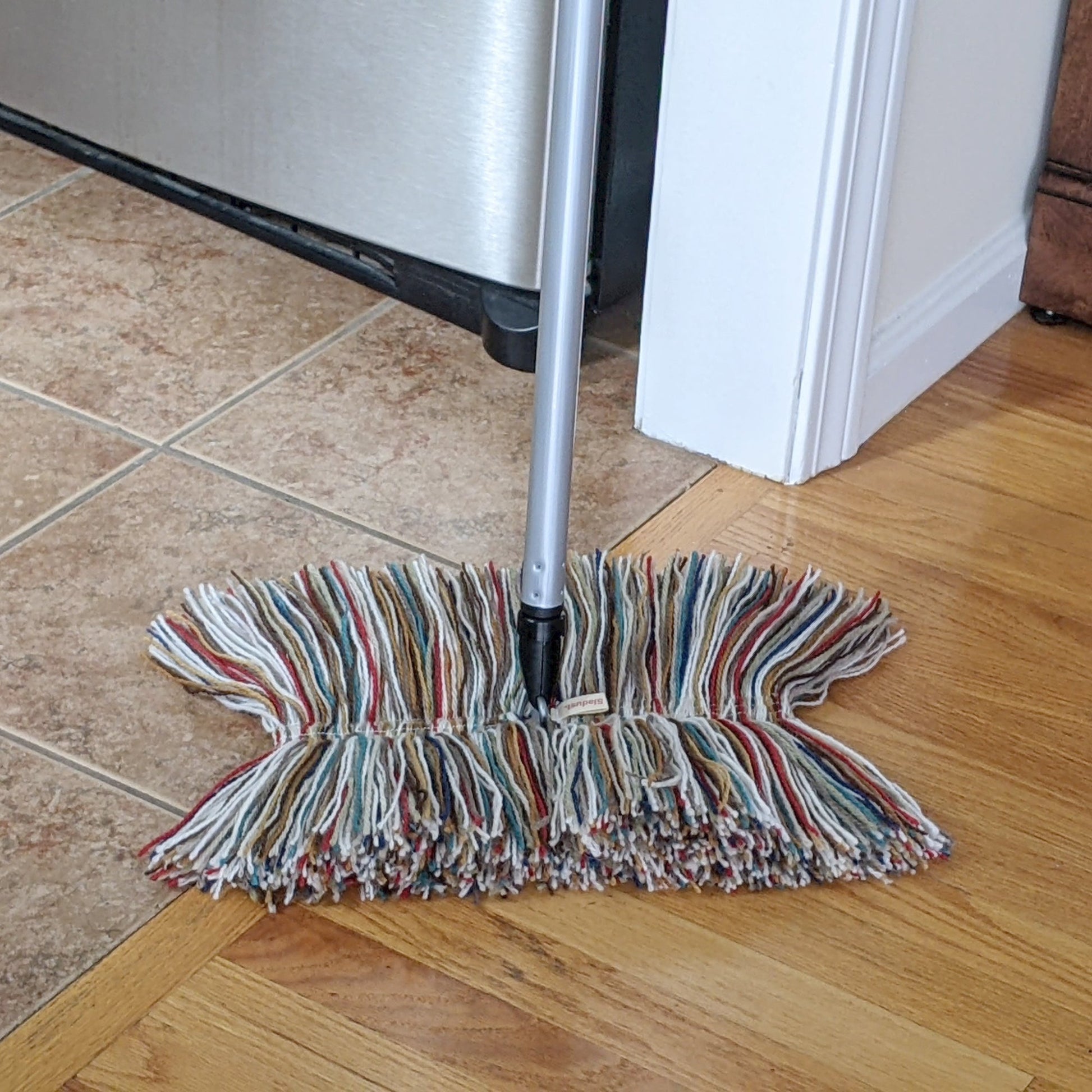 Big Wooly All Wool Dust Mop by Sladust with metal handle, showing a large wool dust mop for cleaning floors.