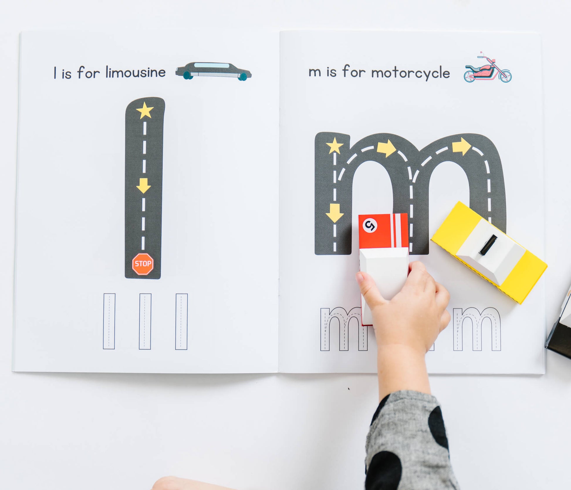 Coloring page from So Handmade Shop's Road Trace Activity Book featuring alphabet and numbers learning activities for children.