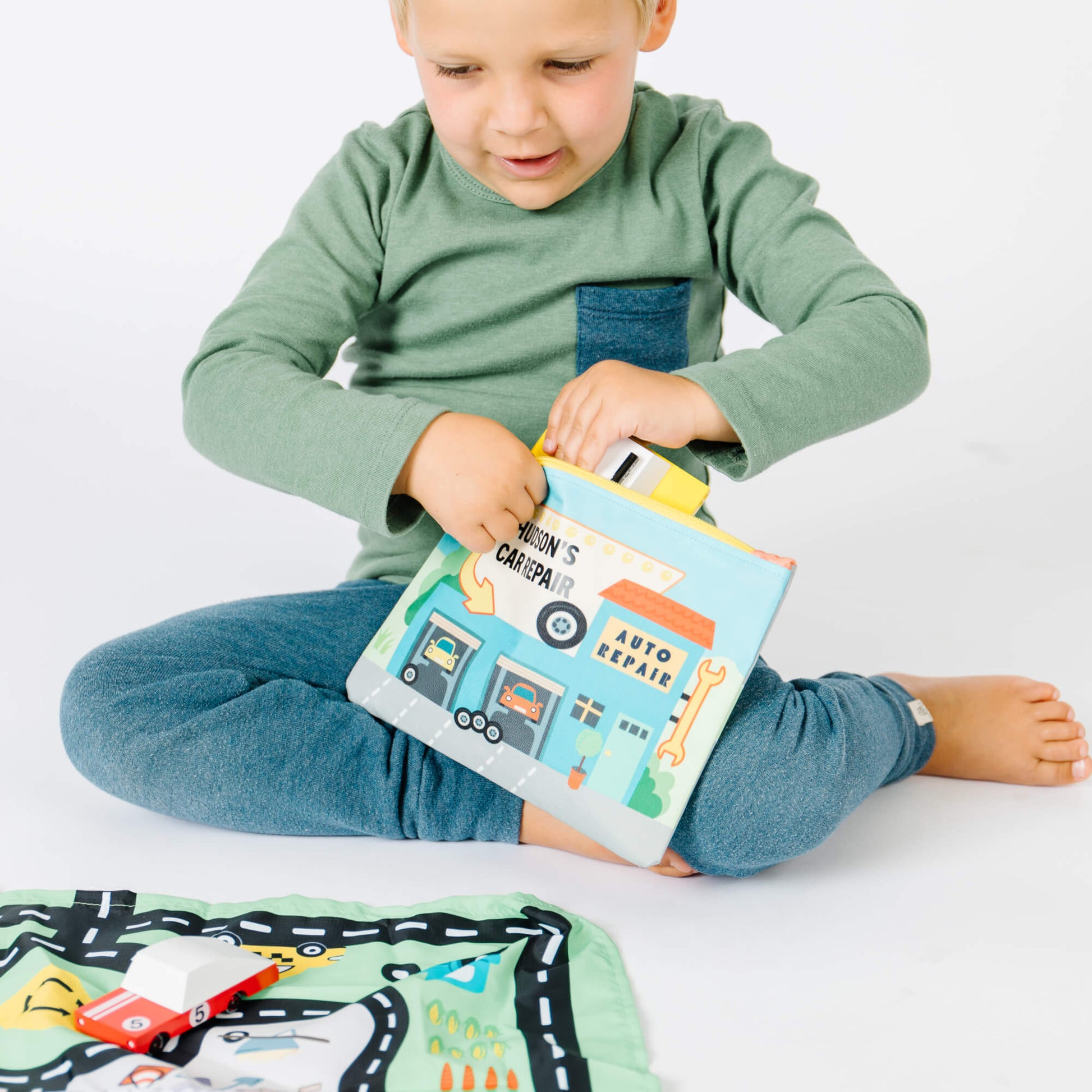 Colorful toy car playmat and pouch from So Handmade Shop, designed for travel entertainment and easy storage.