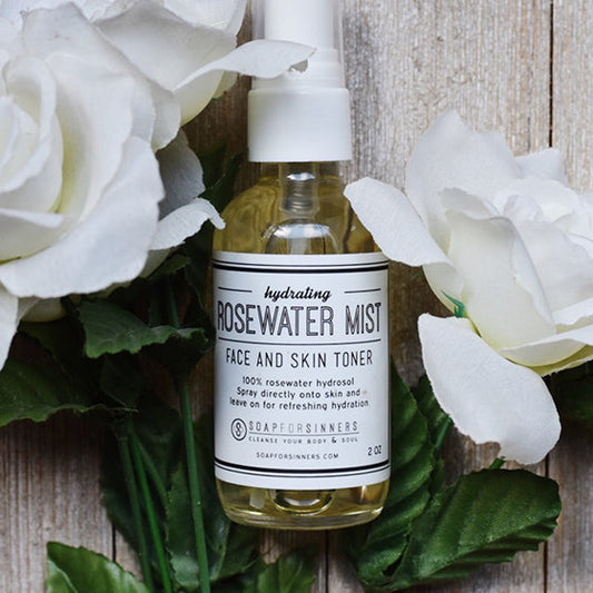 2oz soap for Sinners Rosewater Mist hydrosol in a clear spray bottle, showcasing a soothing floral facial mist.