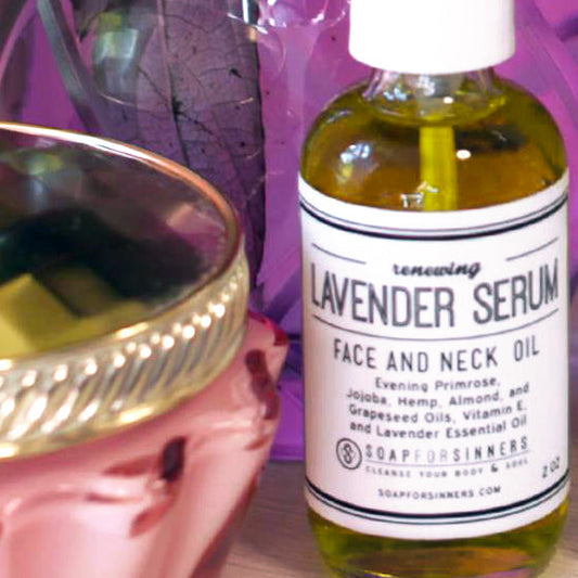 Lavender Serum 2oz by Soap for Sinners, a soothing lavender oil in a clear glass bottle with a black pump dispenser.
