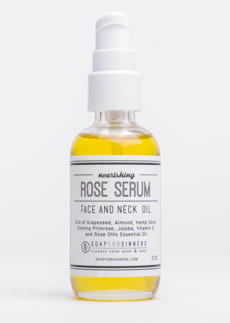 Rose Serum oil by Soap for Sinners in a 2oz bottle, featuring a clear glass container with a white pump dispenser and rose-themed label.