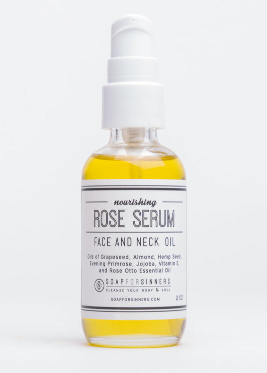 Rose Serum oil by Soap for Sinners in a 2oz bottle, featuring a clear glass container with a white pump dispenser and rose-themed label.