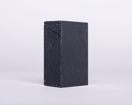 Soap for Sinners bamboo charcoal with cedarwood soap bar showing textured surface and natural ingredients.