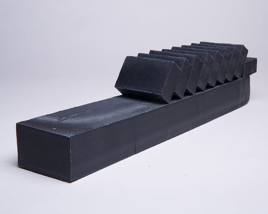 Bar of Soap for Sinners with bamboo charcoal and cedarwood, showcasing the natural soap bar with textured surface and earthy tones.