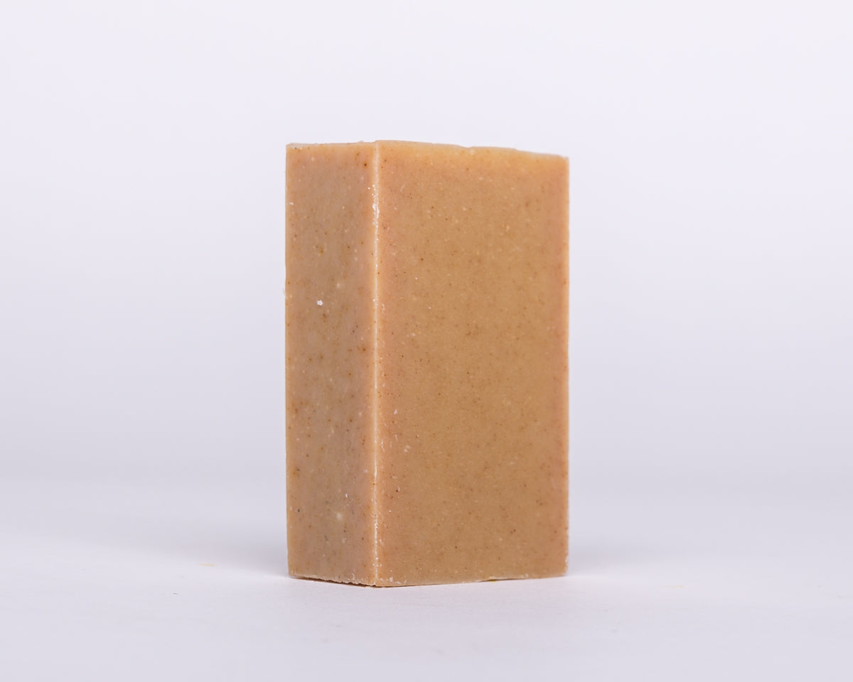 Bar of Soap for Sinners Patchouli Orange with Turmeric, natural soap with earthy scent and vibrant orange hue.