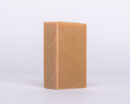 Bar of Soap for Sinners Patchouli Orange with Turmeric, natural soap with earthy scent and vibrant orange hue.