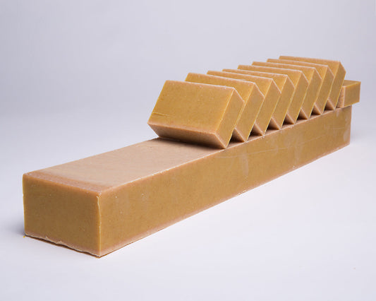 Bar of Soap for Sinners Patchouli Orange with Turmeric soap, showcasing a natural, handcrafted soap bar with vibrant orange and earthy tones.