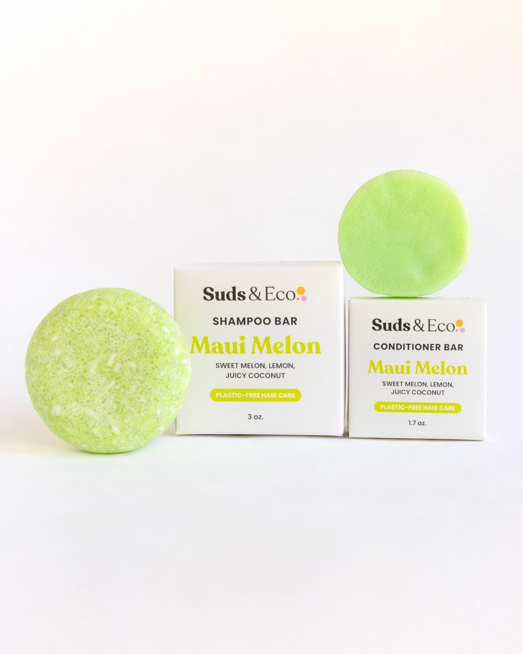 Two light green bars, one rough and one smooth, are shown with boxes labeled ZeroWasteStore.com Shampoo & Conditioner Bar Duo in Maui Melon, highlighting zero waste hair care.