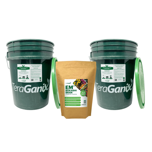 Two green TeraGanix Bokashi Food Waste Recycling System buckets with lids, placed beside a brown bag of EM Bokashi Bran, form an ideal starter kit for simple food waste recycling on a white background.