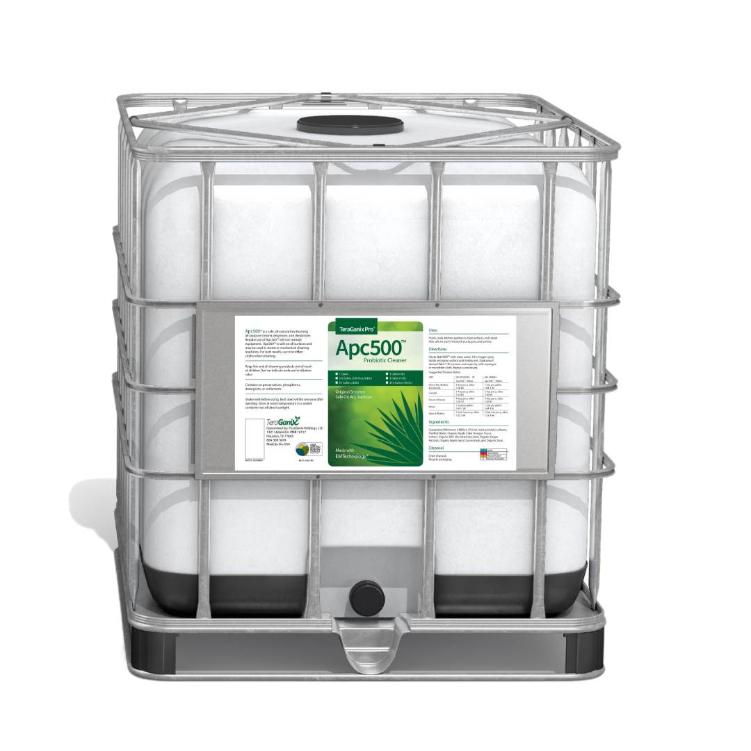 The APC500 Nontoxic All-purpose Cleaning product by Teraganix Wholesale comes in a large white industrial container with a metal cage, ideal for storing and transporting concentrated cleaners.