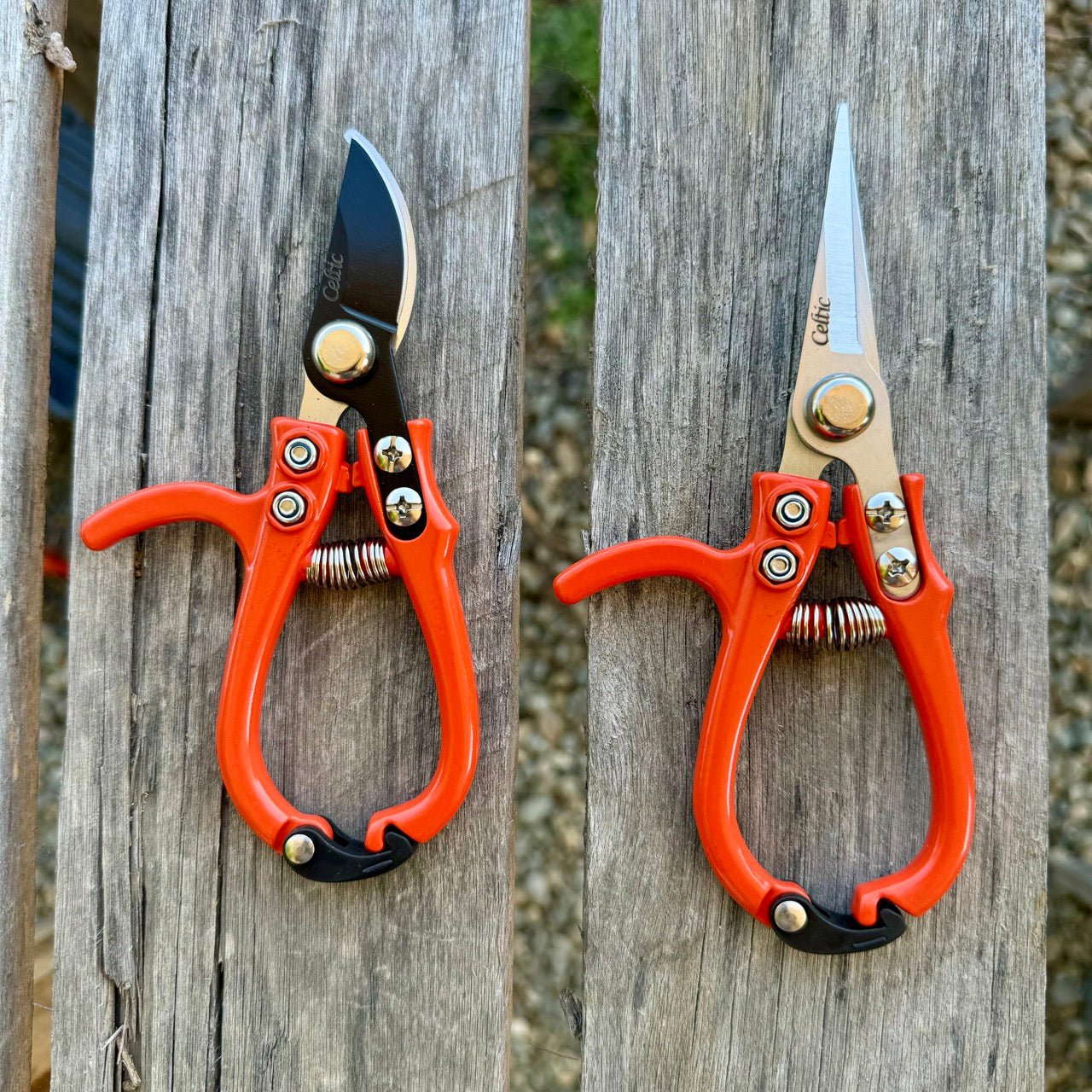 The Celtic Farm’s Mini Hand Pruner Gift Set includes two ergonomic pruners—one with a curved blade, one with straight blades—both with red handles; perfect for light gardening and indoor plant care.